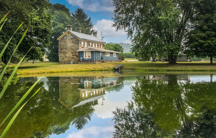 Built in 1838, this extraordinary 3,000-square-foot stone home - photo 2