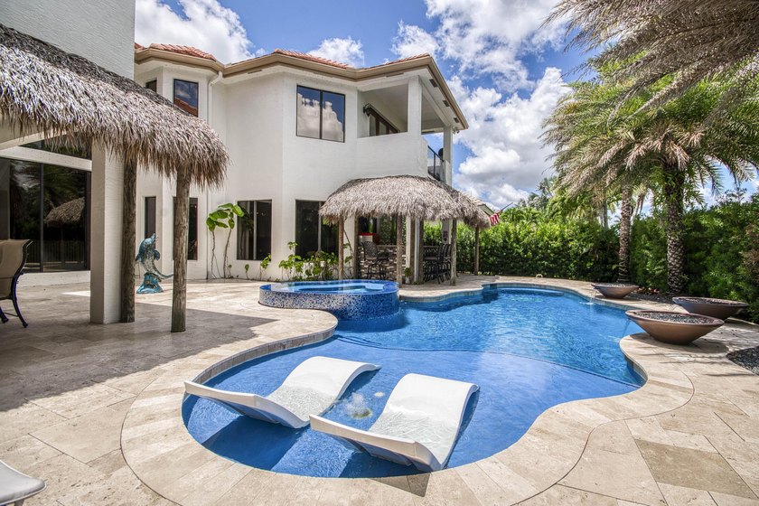 A private backyard paradise with a custom Van Kirk pool, tiki - photo 3