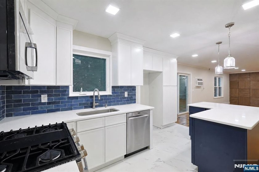 Welcome to this beautifully renovated ranch, nestled in a - photo 3