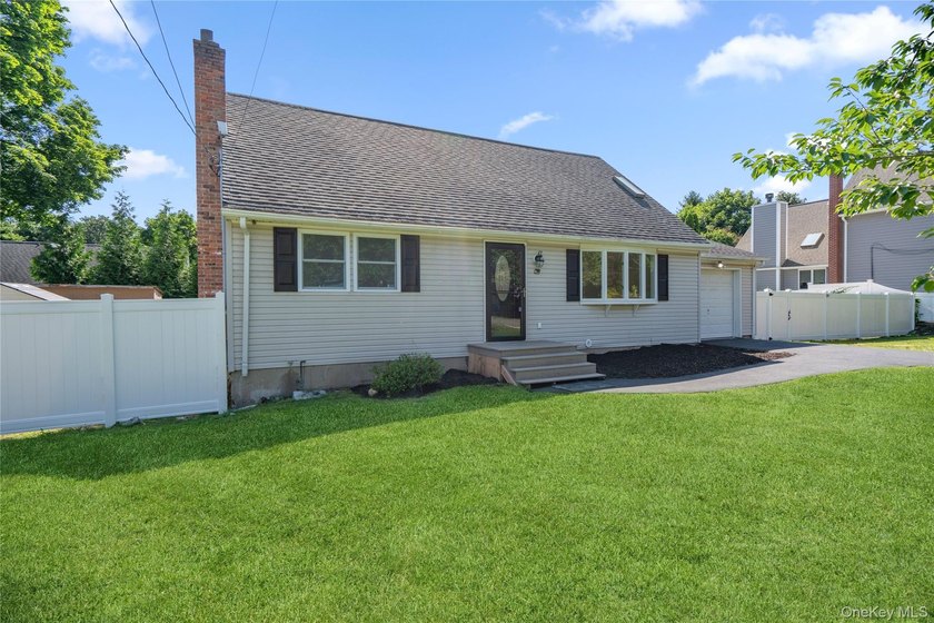 Welcome to this beautifully renovated 4-bedroom, 2-bath Cape - photo 2