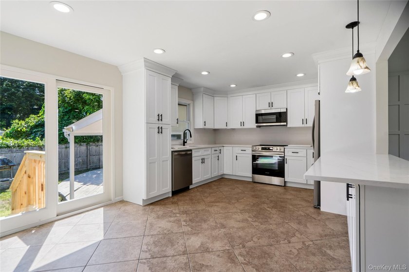 Welcome to this beautifully renovated 4-bedroom, 2-bath Cape - photo 8