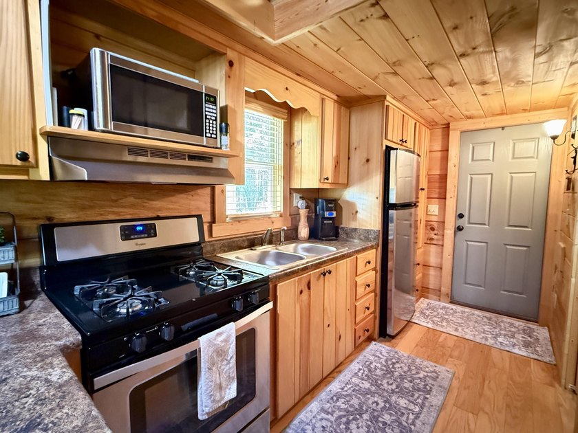 Set on 32.69 scenic acres, this charming log home offers a - photo 11