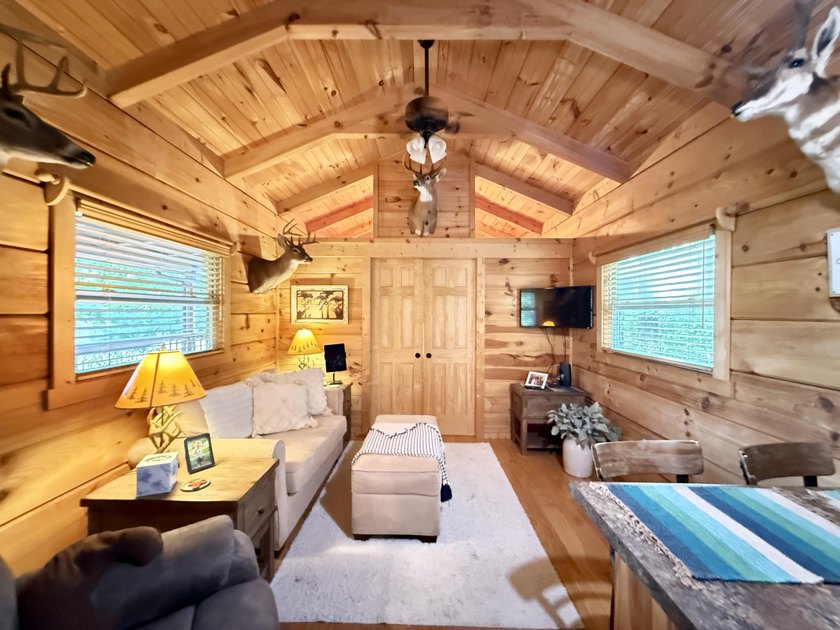 Set on 32.69 scenic acres, this charming log home offers a - photo 16