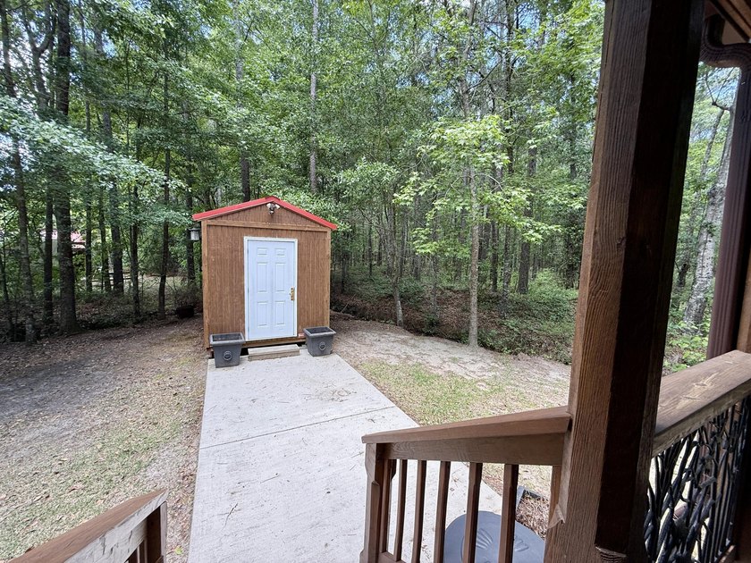 Set on 32.69 scenic acres, this charming log home offers a - photo 28