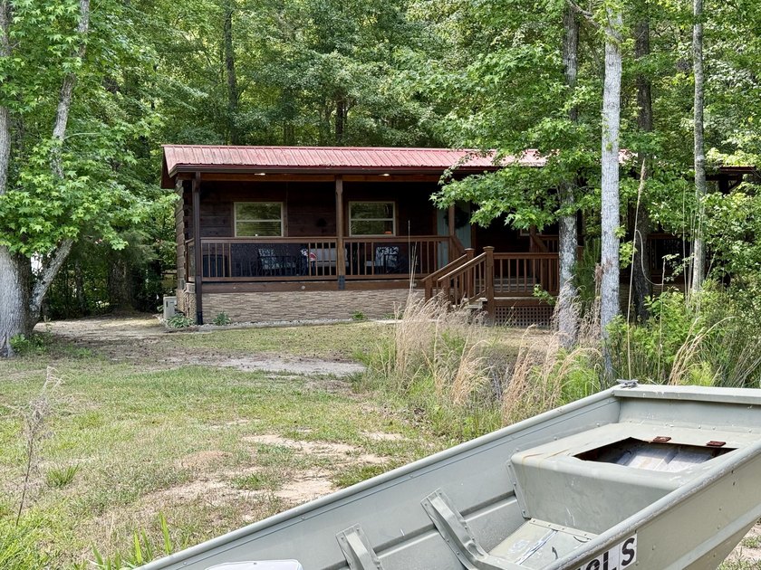 Set on 32.69 scenic acres, this charming log home offers a - photo 41