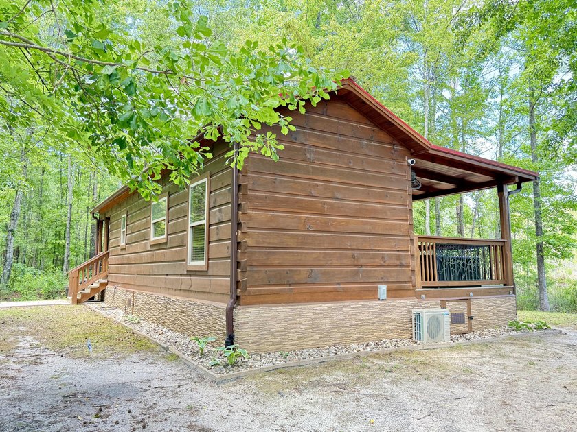 Set on 32.69 scenic acres, this charming log home offers a - photo 46