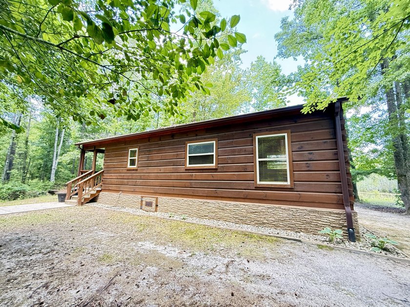Set on 32.69 scenic acres, this charming log home offers a - photo 47