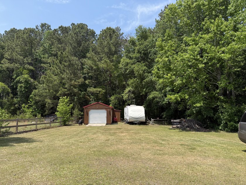 Set on 32.69 scenic acres, this charming log home offers a - photo 49