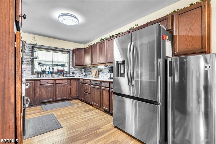 Situated on a spacious 0.65-acre corner lot surrounded by mature - photo 8
