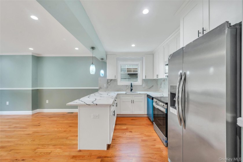 Introducing a stunning 2026-built legal two-family home situated - photo 15