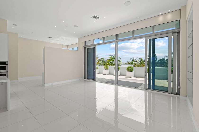 Step through the lobby level entry into ceilings that hold at - photo 12