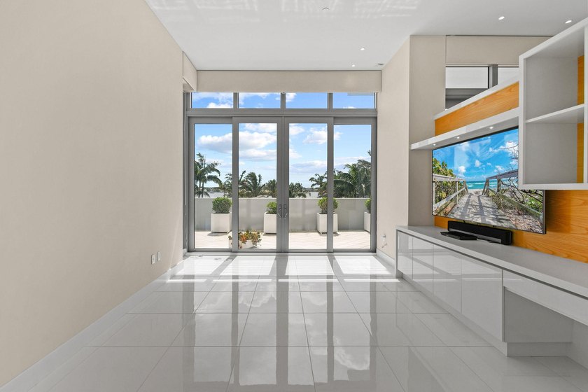 Step through the lobby level entry into ceilings that hold at - photo 19