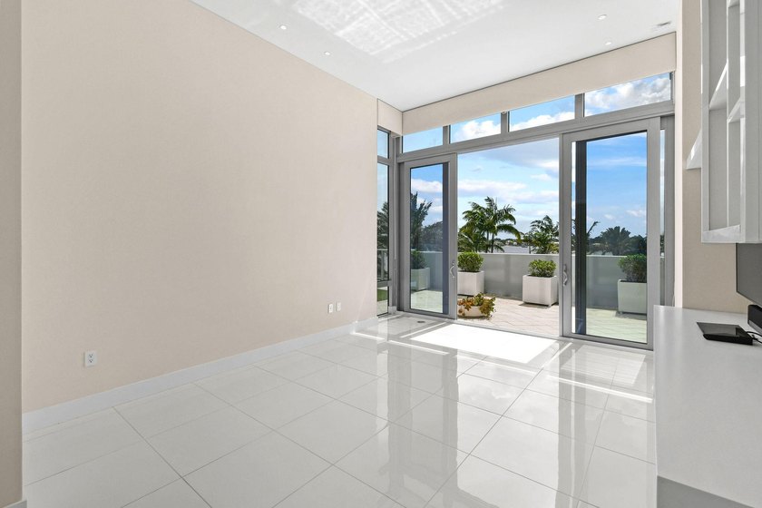 Step through the lobby level entry into ceilings that hold at - photo 22
