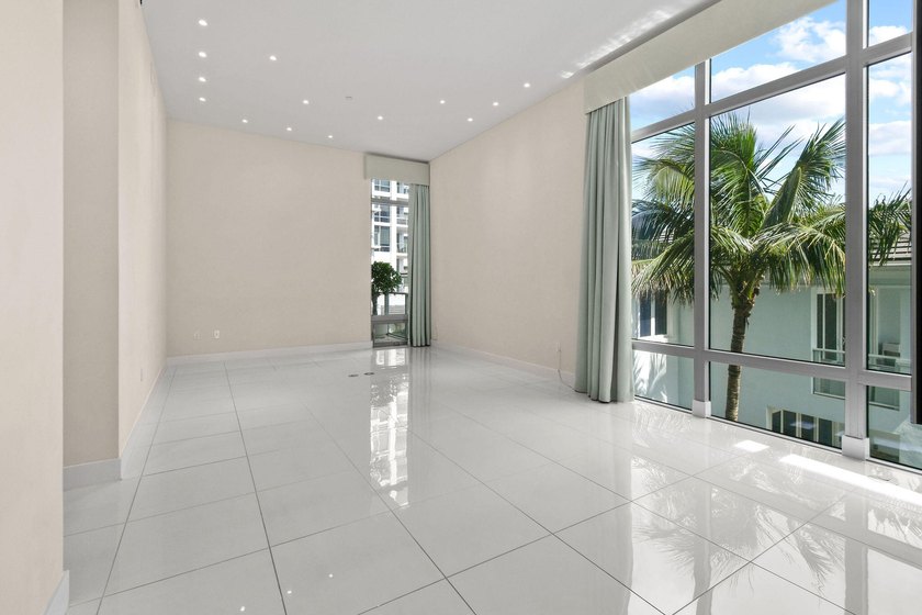 Step through the lobby level entry into ceilings that hold at - photo 24