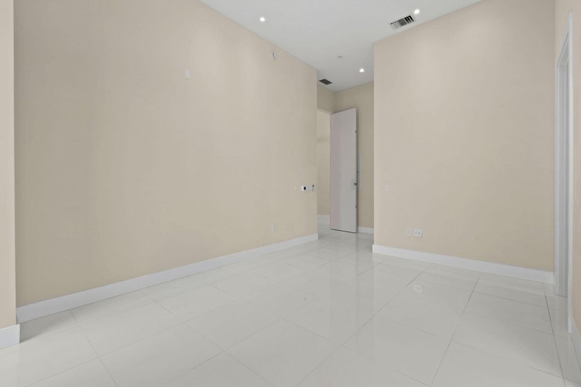 Step through the lobby level entry into ceilings that hold at - photo 44