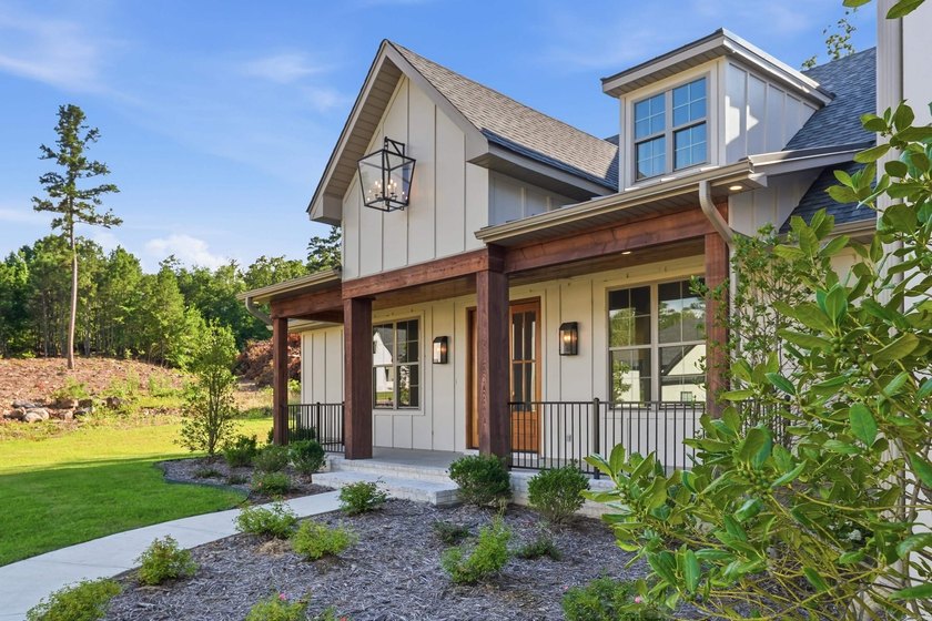 This 4 bed, 3.5 bath home sits on a flat 0.5 acre lot with 115' - photo 2