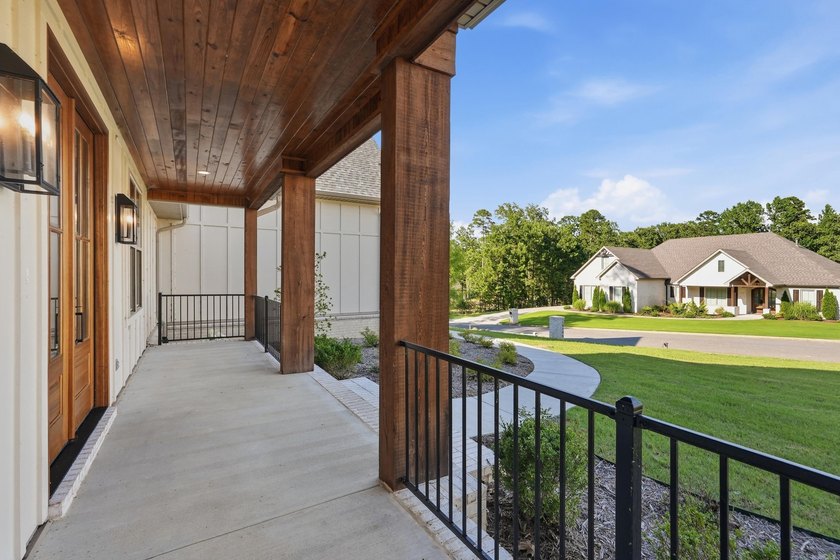 This 4 bed, 3.5 bath home sits on a flat 0.5 acre lot with 115' - photo 4