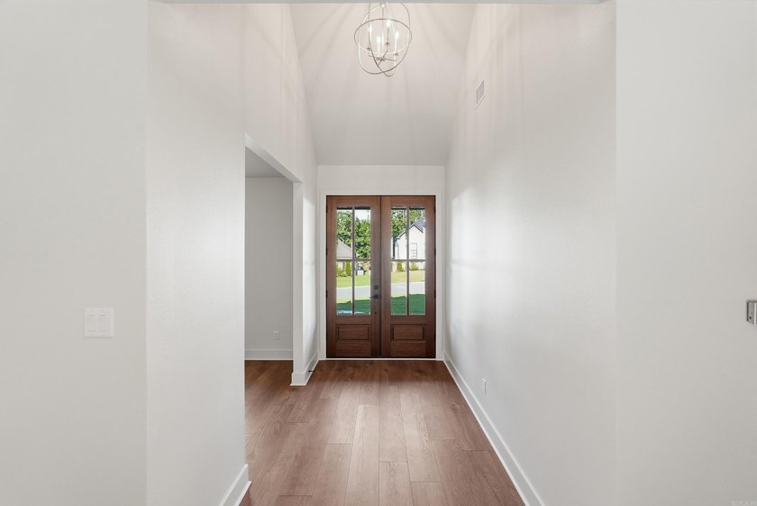 This 4 bed, 3.5 bath home sits on a flat 0.5 acre lot with 115' - photo 5