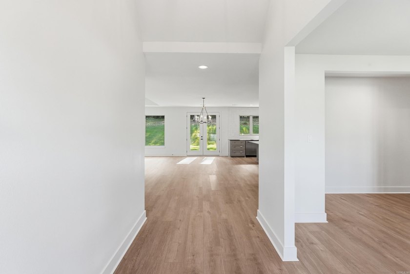 This 4 bed, 3.5 bath home sits on a flat 0.5 acre lot with 115' - photo 6