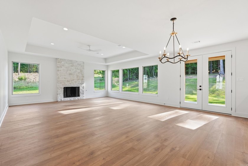 This 4 bed, 3.5 bath home sits on a flat 0.5 acre lot with 115' - photo 9