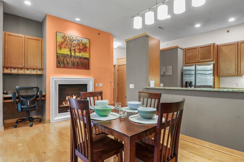 Perched on the top floor, this spacious 1BR condo offers an - photo 3