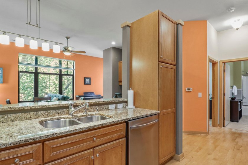 Perched on the top floor, this spacious 1BR condo offers an - photo 4