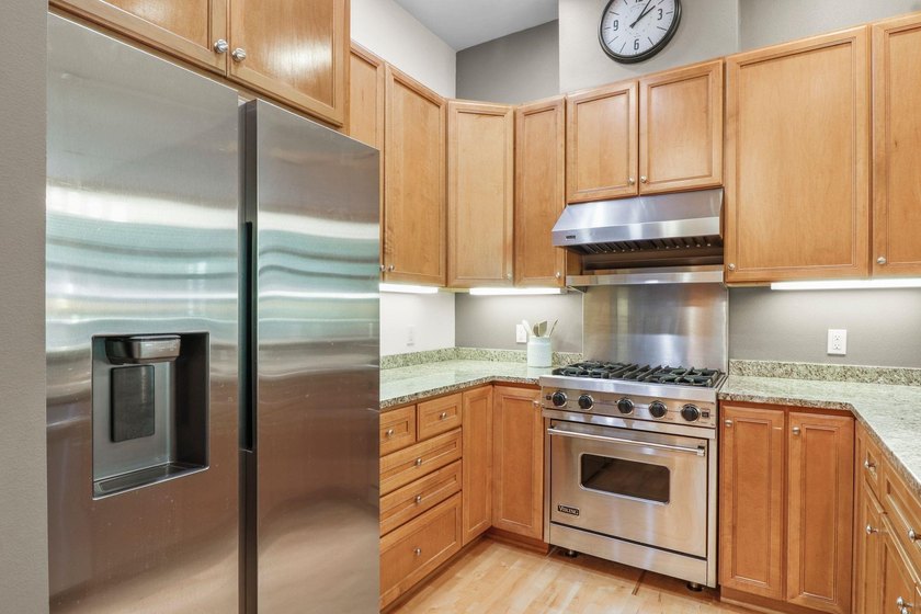 Perched on the top floor, this spacious 1BR condo offers an - photo 7