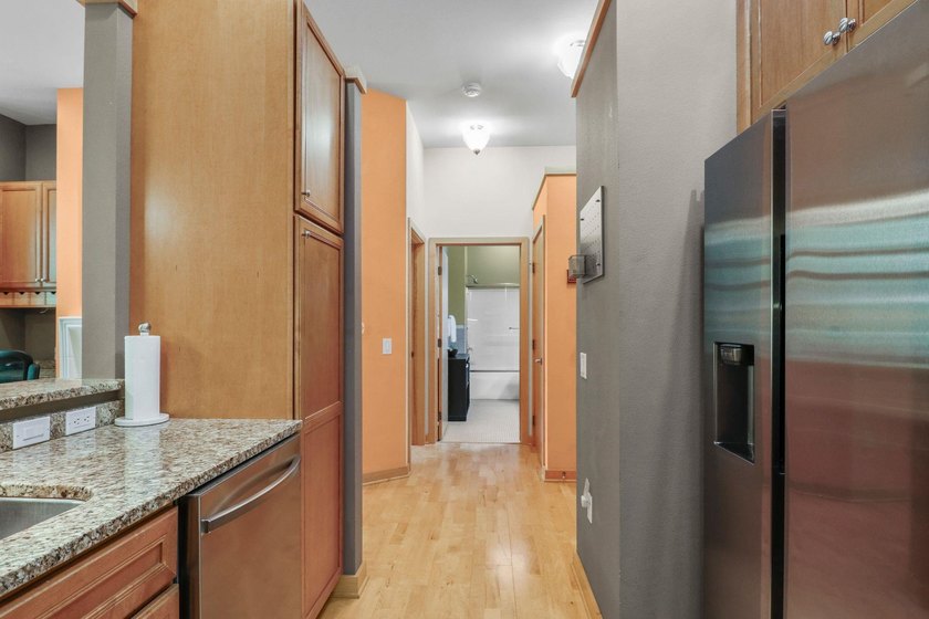 Perched on the top floor, this spacious 1BR condo offers an - photo 8