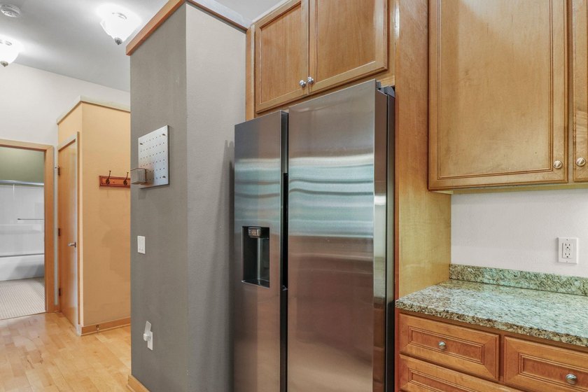 Perched on the top floor, this spacious 1BR condo offers an - photo 9