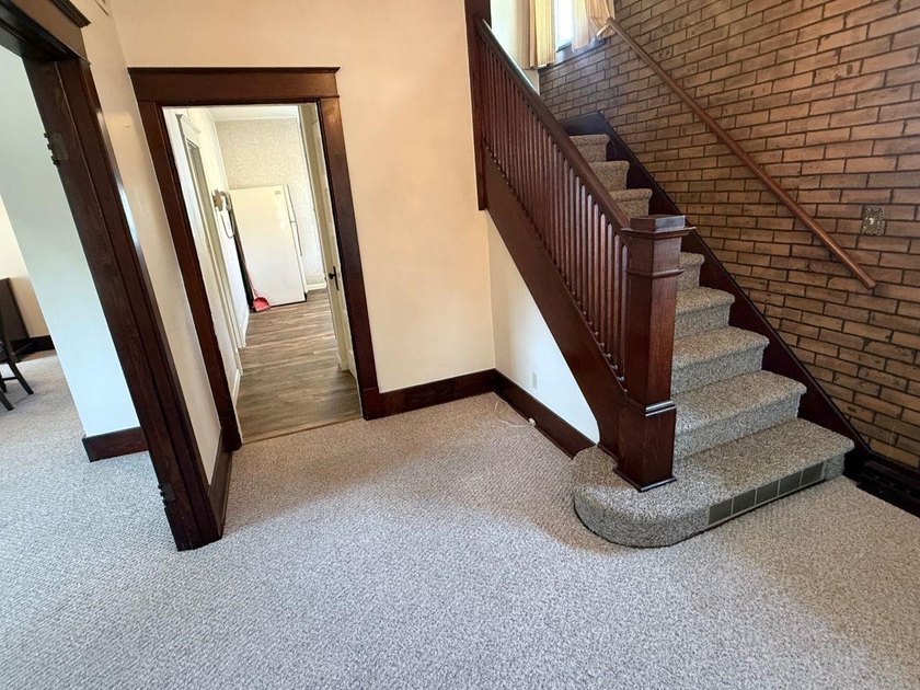 This charming 4-bedroom home sits on a desirable corner lot and - photo 2