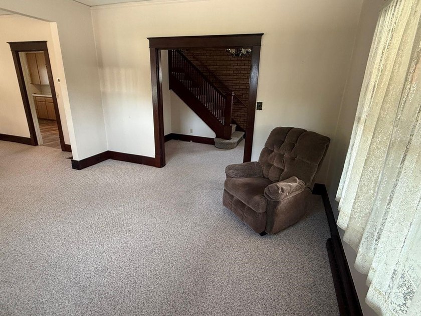 This charming 4-bedroom home sits on a desirable corner lot and - photo 3