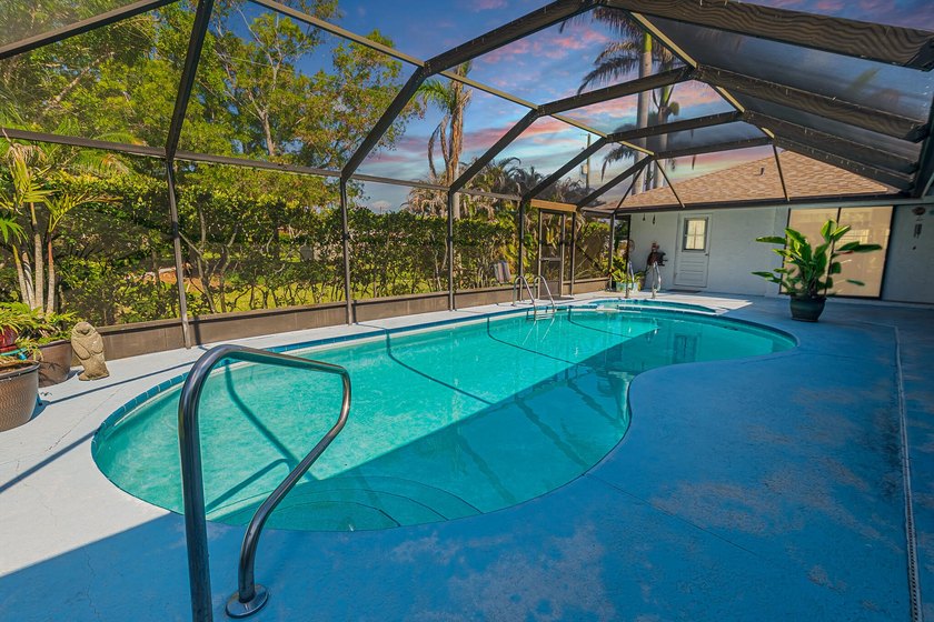 Tropical living awaits in Sandpiper Bay! Situated on an - photo 2
