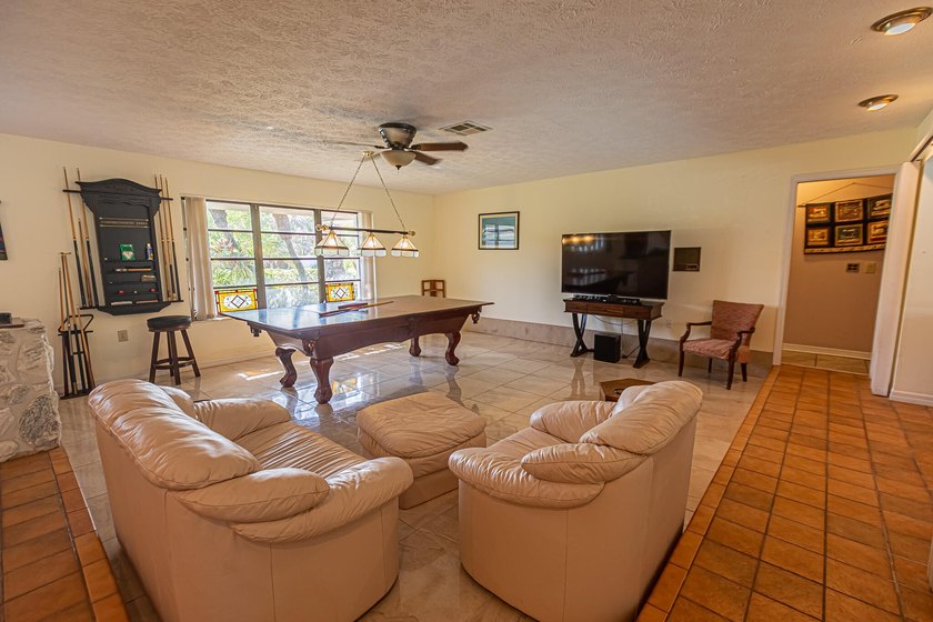 Tropical living awaits in Sandpiper Bay! Situated on an - photo 3