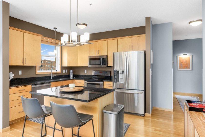 This beautifully updated end-unit condo is filled with natural - photo 5