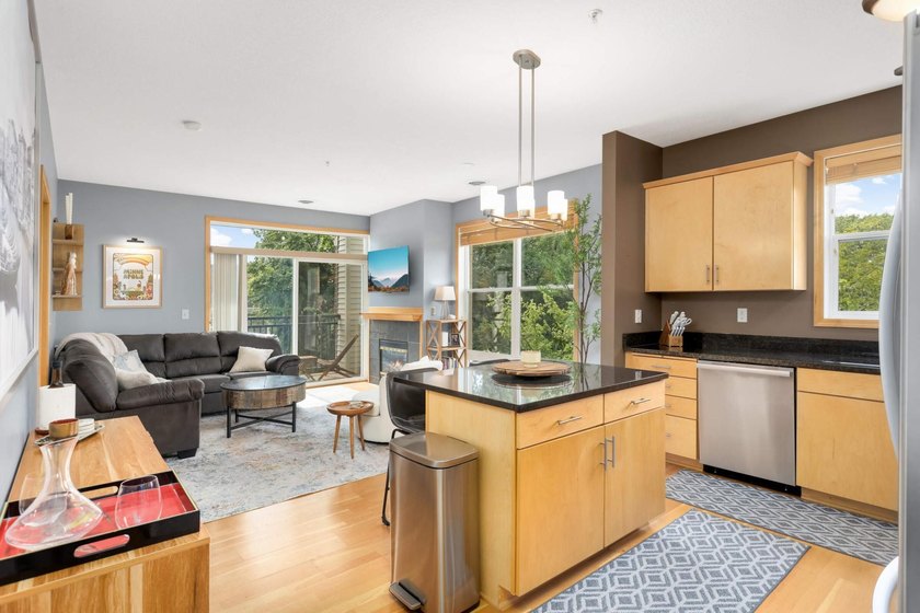 This beautifully updated end-unit condo is filled with natural - photo 6