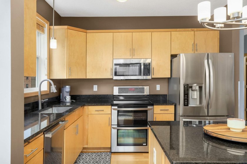 This beautifully updated end-unit condo is filled with natural - photo 10
