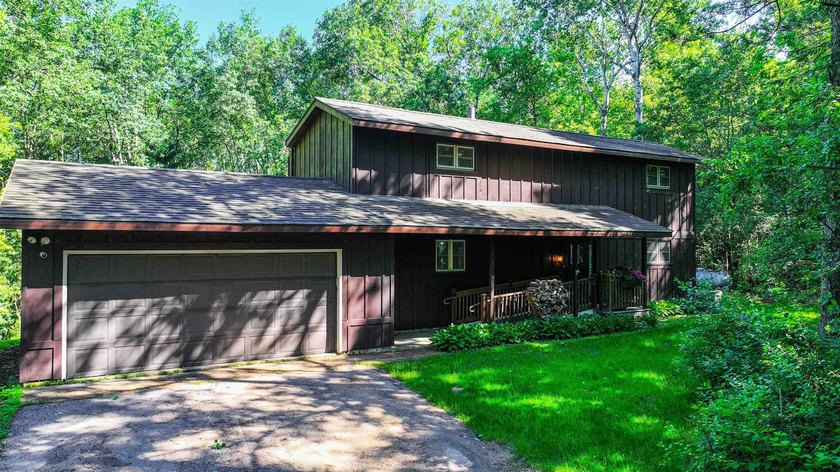 Nestled on two wooded lots just south of Waupaca, this 3BR, 2BA - photo 2