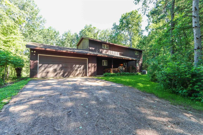 Nestled on two wooded lots just south of Waupaca, this 3BR, 2BA - photo 4