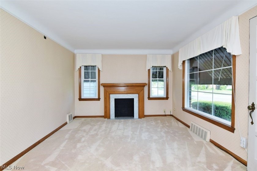 This charming and well maintained brick home has been in the - photo 3