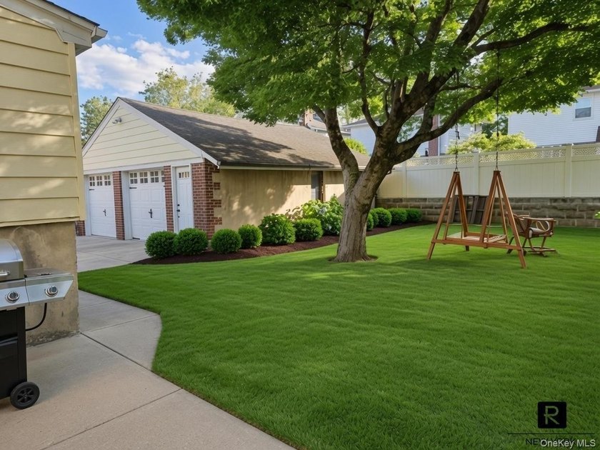 This well-maintained brick two-family home offers an exceptional - photo 2