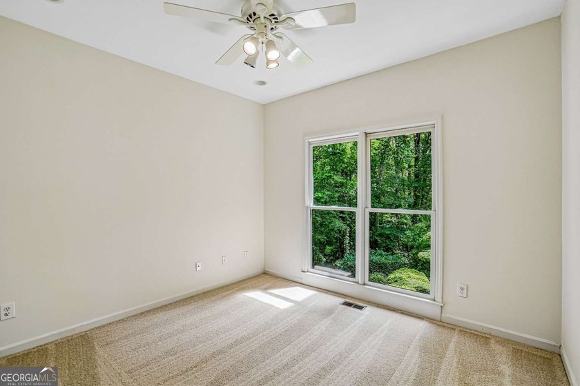 Nestled on a quiet cul-de-sac lot backing to acres of private - photo 14