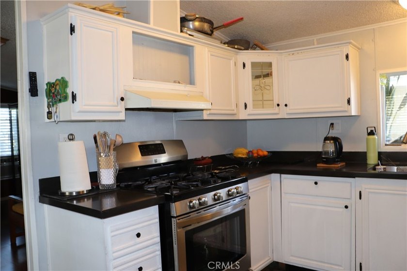 SUPER NICE HOME IN A FAMILY PARK! NESTLED INSIDE THIS SMALL - photo 4