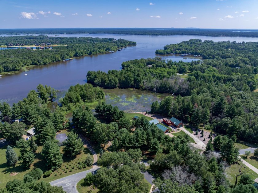 Enjoy 100 feet of owned frontage on Castle Rock Lake with this - photo 7
