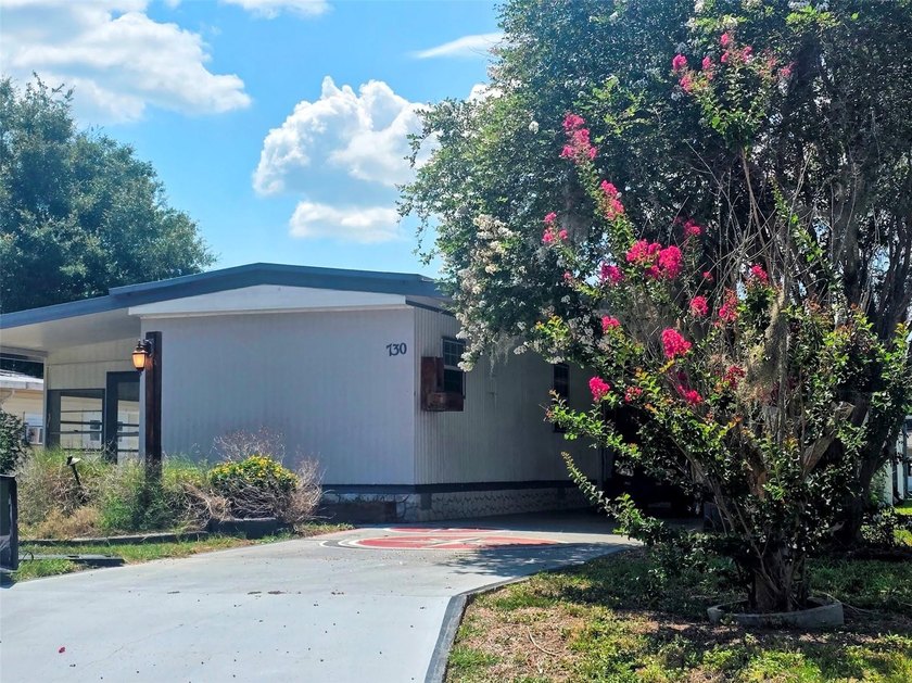 This manufactured home sits on owned land in The Villages. No - photo 3
