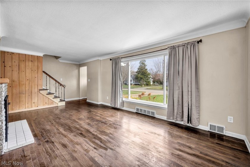 Welcome to 180 E. 264th Street, a beautifully updated 3-bedroom - photo 6