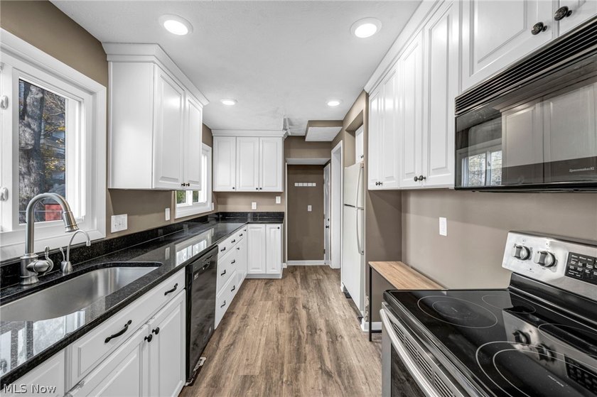 Welcome to 180 E. 264th Street, a beautifully updated 3-bedroom - photo 9