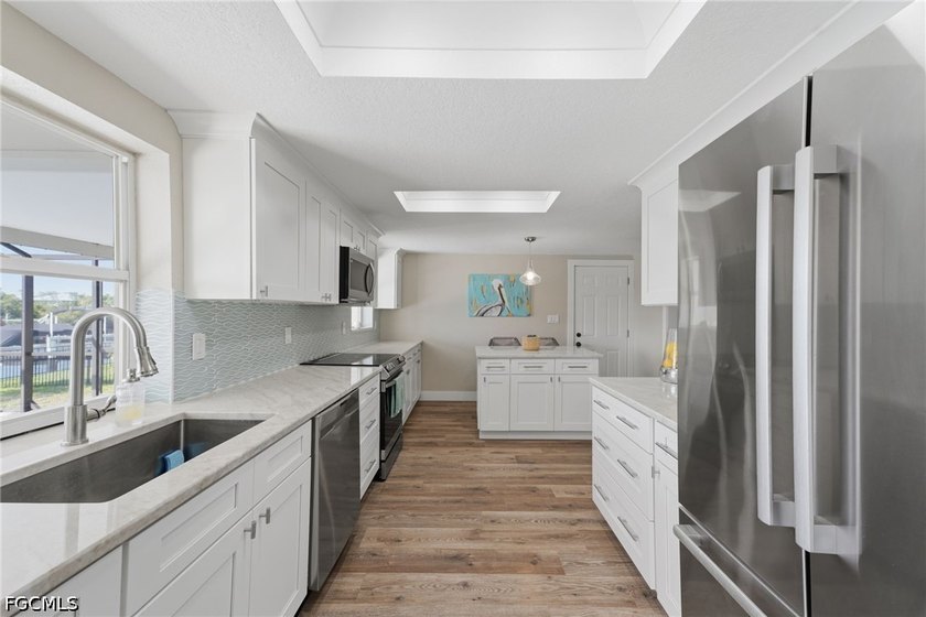 Welcome to 5400 Almar Drive, a rare waterfront gem situated on a - photo 10