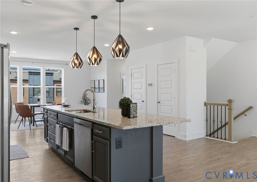 This beautifully designed two-story townhome style condo with a - photo 13