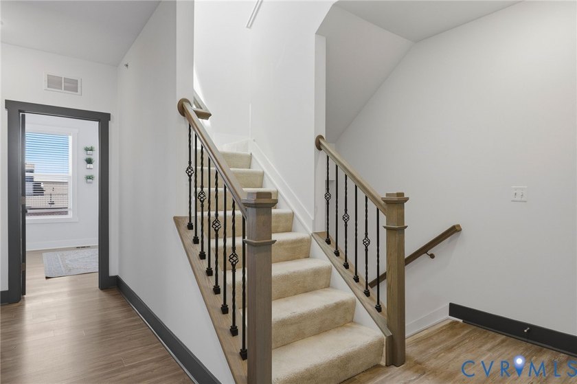 This beautifully designed two-story townhome style condo with a - photo 17