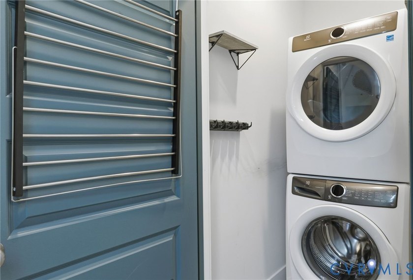 This beautifully designed two-story townhome style condo with a - photo 26